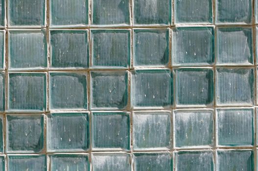 The old wall is lined with numerous glass blocks.Texture or background