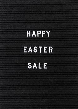 Easter hliday concept. The words Happy Easter Sale on the black felt letter board