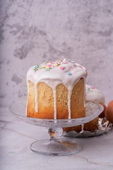 Easter holiday concept. Easter Cake with eggs on white marble background front view with copy space