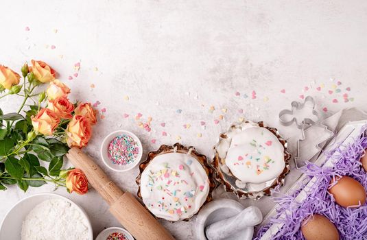 Easter concept. Baking and cooking. Easter cake ingredients on whitemarble table top view flat lay with copy space