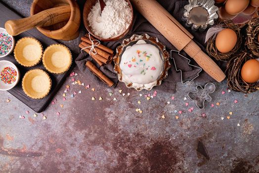 Baking concept. Easter concept. Ingredients for an Easter cake flat lay top view on dark background