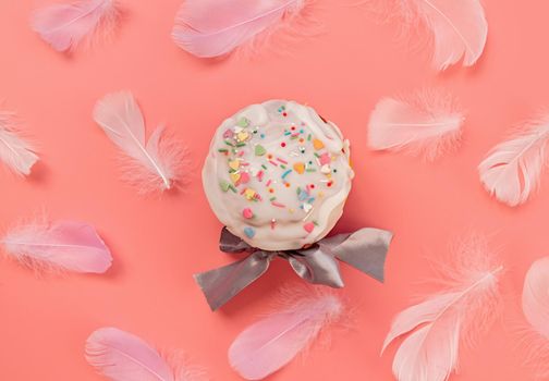 Easter concept. Easter cake surrounder with feathers top view flat lay