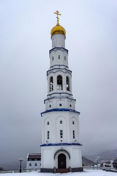 Petropavlovsk-Kamchatsky, Russia. the Church of St. Nicholas against a white snowy sky.