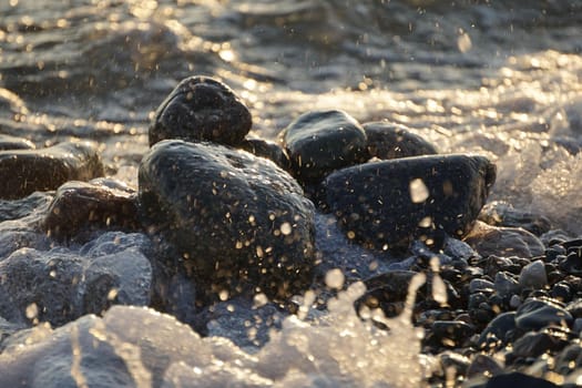 Natural background with large stones and waves.