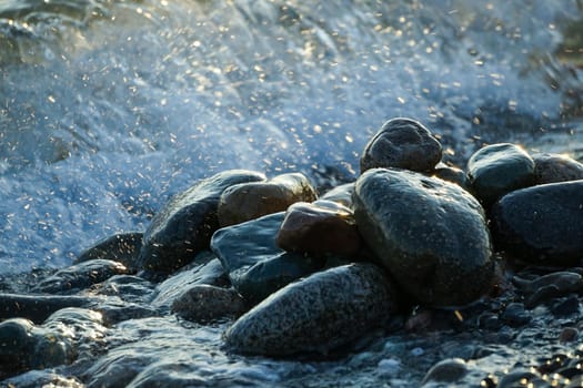 Natural background with large stones and waves.