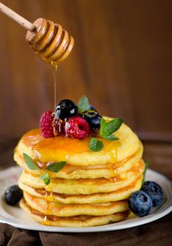 Stack of pancakes with fresh berries, close-up