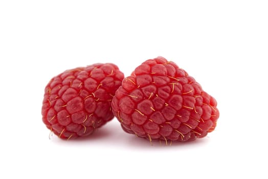 Red ripe raspberry fruits isolated on white background