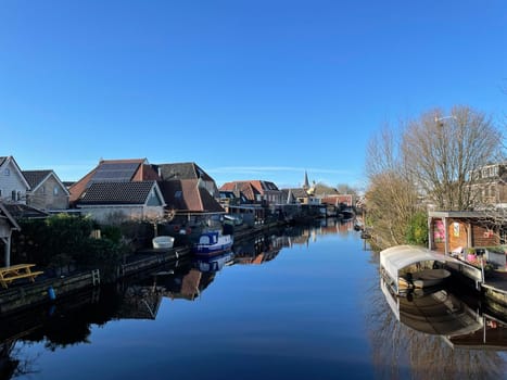 Canal in Akkrum on a winter day in Friesland The Netherlands