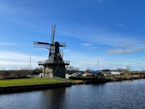 Windmill next to a canal in Joure Friesland The Netherlands