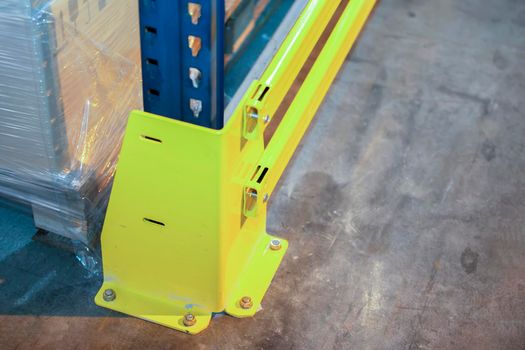 Part of fastening metal structure of warehouse shelves for storing products.