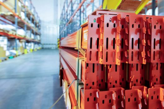 Warehouse premises of a factory or workshop with metal shelves.