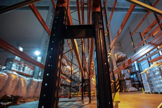 Warehouse premises of a factory or workshop with metal shelves.