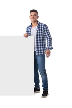 Full length portrait of happy smiling casual man holds blank board isolated on white background