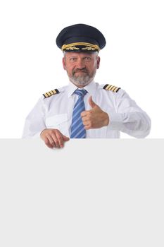 Full length portrait of happy smiling pilot holds blank banner isolated on white background