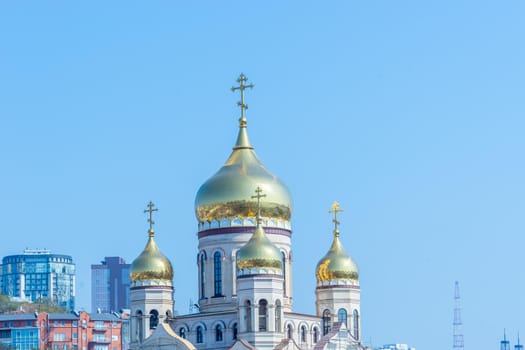 Vladivostok, Russia. Urban landscape with a view of the Golden domes of the temple