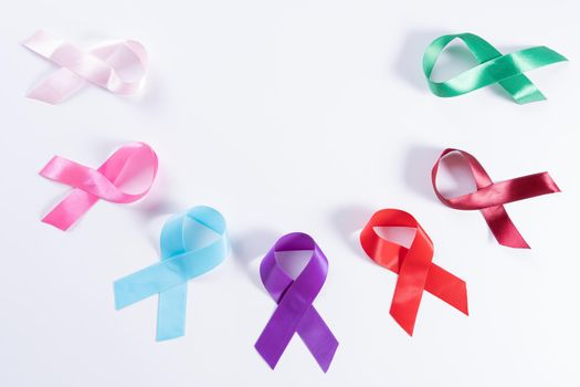 World cancer day, colorful ribbon cancer awareness on with background with copy space for text. Healthcare and medical concept.