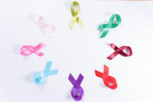 World cancer day, colorful ribbon cancer awareness on with background with copy space for text. Healthcare and medical concept.