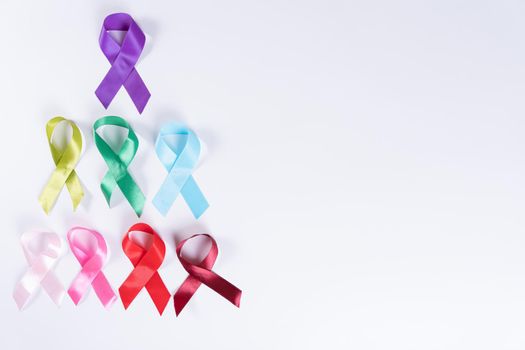 World cancer day, colorful ribbon cancer awareness on with background with copy space for text. Healthcare and medical concept.