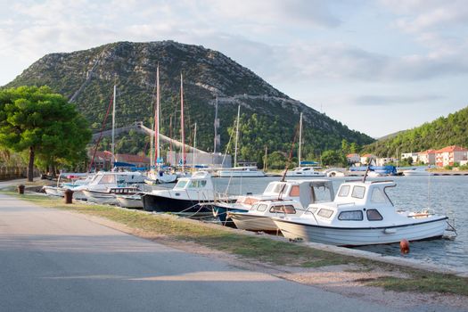 Sailing yachts in small marina of Mediterranean Adriatic sea bay