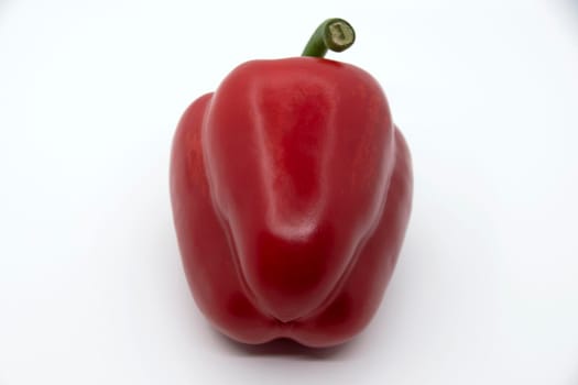 Ripe juicy sweet bell pepper on a white background.