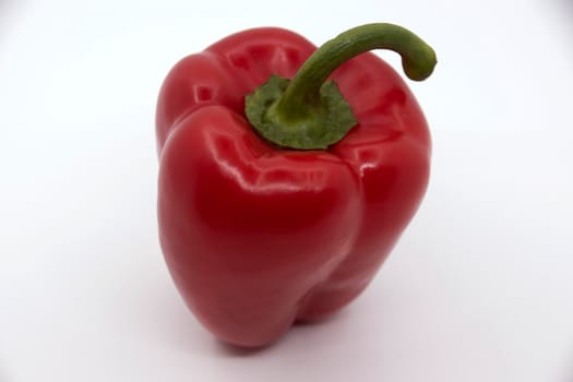 Ripe juicy sweet bell pepper on a white background.