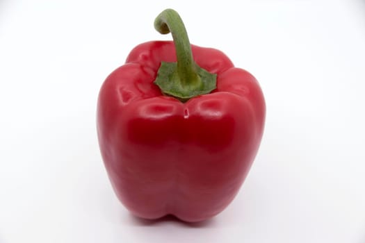 Ripe juicy sweet bell pepper on a white background.