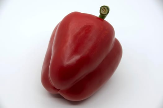 Ripe juicy sweet bell pepper on a white background.