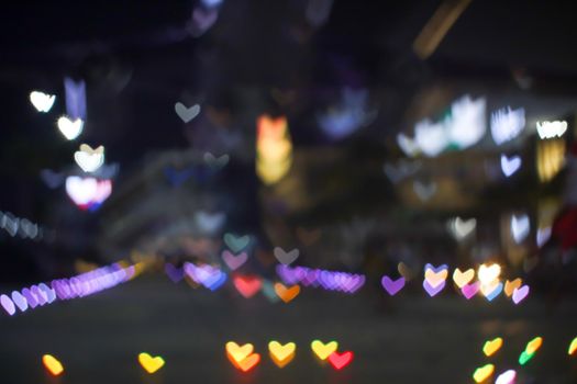 orange bokeh and blur heart shape love valentine day colorful night light on floor