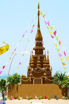 high sand pagoda in Songkran festival represents In order to take the sand scraps attached to the feet from the temple to return the temple in the shape of a sand pagoda