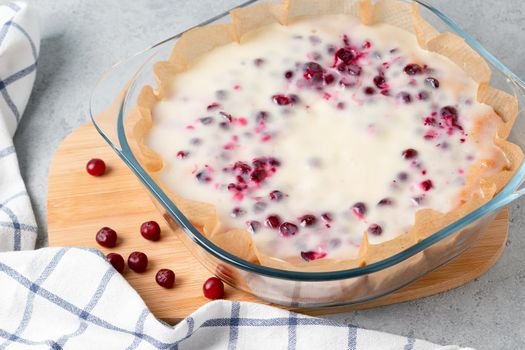 Homemade cranberry and sour cream pie in a glass baking dish.