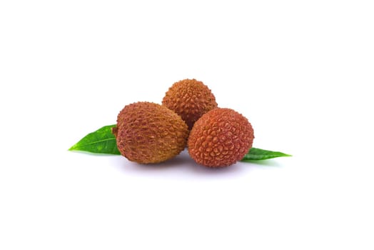 Three lychee fruit composition with green leaves decoration isolated on white background
