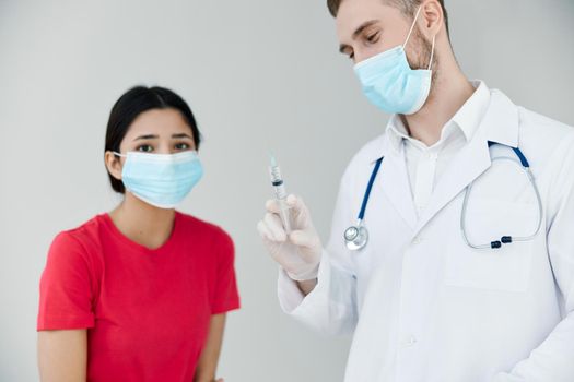 doctor holding vaccination and health in hands next to woman patient. High quality photo