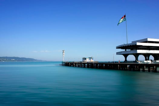 Sukhumi, Abkhazia. The building of the sea station of Soviet construction on the background of the seascape.