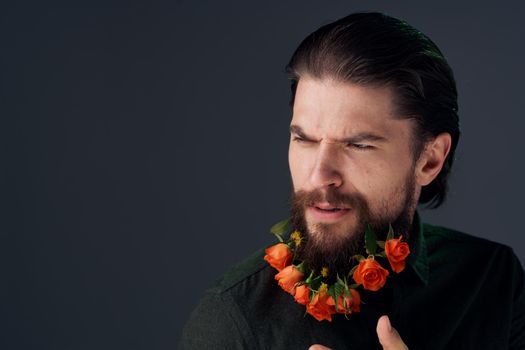 Cute man flowers in beard ornaments elegant style close-up. High quality photo