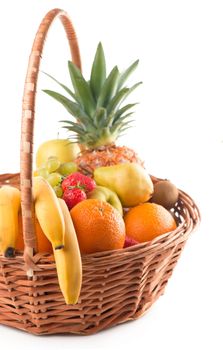 Fresh fruit in the basket against a white background