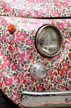 PARIS, FRANCE - CIRCA MARCH 2010: Detail of a Fiat 500 wrapped with a flowery pattern vinyl wrap