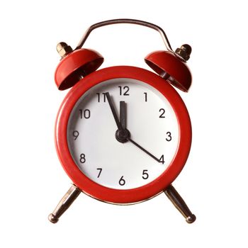 An isolated over white background image of a red alarm clock displaying a time of five minutes to twelve oclock.