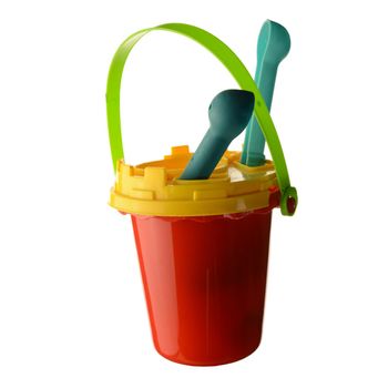 An isolated over white background image of a red sand bucket with various accessories like a sifter and shovel.