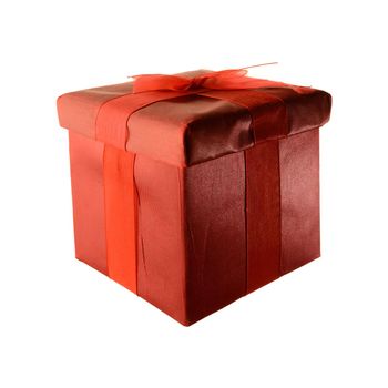 An isolated over white background image of a square red gift box wrapped in fabric and ribbon.