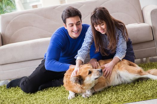 Happy family with golden retriever dog