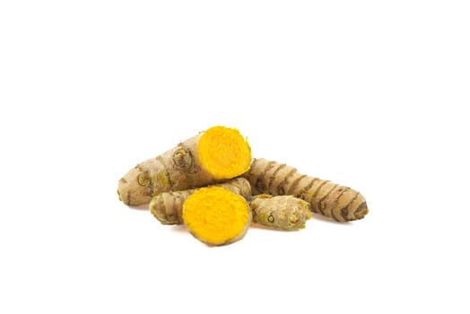 Fresh raw turmeric roots isolated on white background