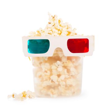 Paper striped bucket with popcorn and 3D glasses isolated on white background with clipping path.