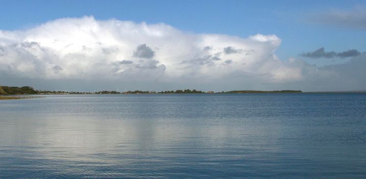 Panorama of white cloud and blue sky with sea on the coastline of Lemvig, Denmark