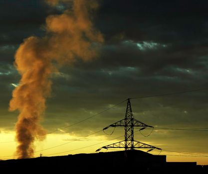 Abstract morning sunrise background with high voltage power line and smoke