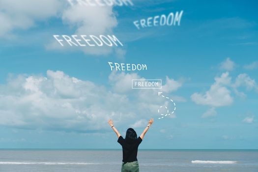 Woman rise hand up to sky with thinking or dreaming to successful freedom life. 