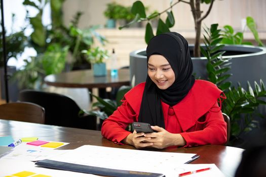 Business people talking in office using digital tablet and social media technology for communication.