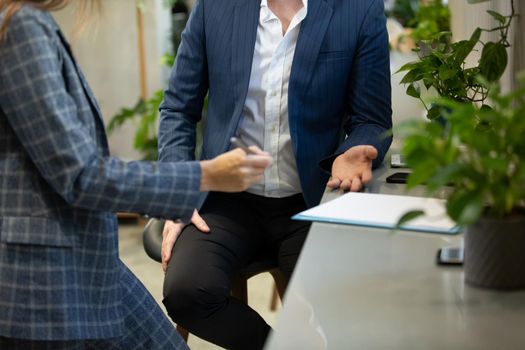 Business people talking in office using digital tablet and computer 