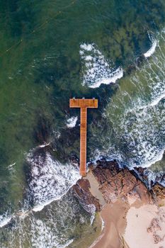 Bornholm, Denmark - August 10, 2020: Top down drone view of a wooden pier in Sandvig village