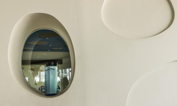 Sport water bottle in sport club or gym and fitness room with free space. Gym concept. Selective focus.