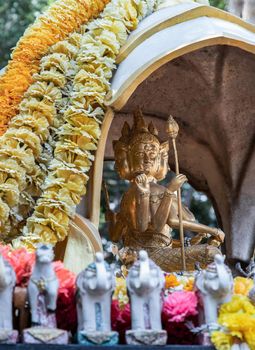 Bangkok, Thailand - 18 Jan 2021 : The Thao Maha Phrom Shrineis a shrine which houses a statue of Phra Phrom (Four faced god). The Thai representation of Brahma, the Hindu god of creation. Selective focus.
